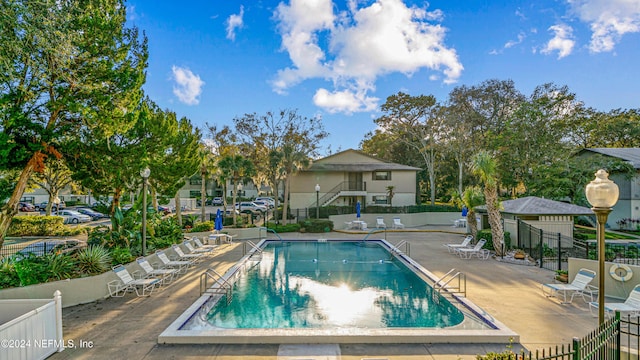 view of swimming pool featuring a patio area