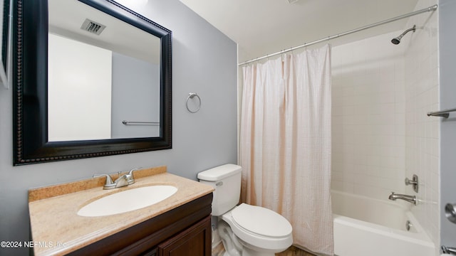 full bathroom with vanity, toilet, and shower / tub combo