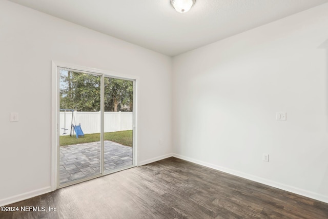 spare room featuring dark hardwood / wood-style flooring