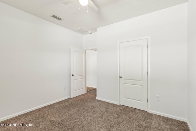 unfurnished bedroom featuring ceiling fan and carpet floors