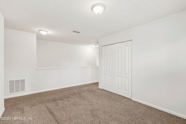 spare room with carpet flooring