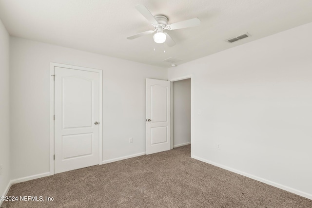 unfurnished bedroom with carpet flooring and ceiling fan