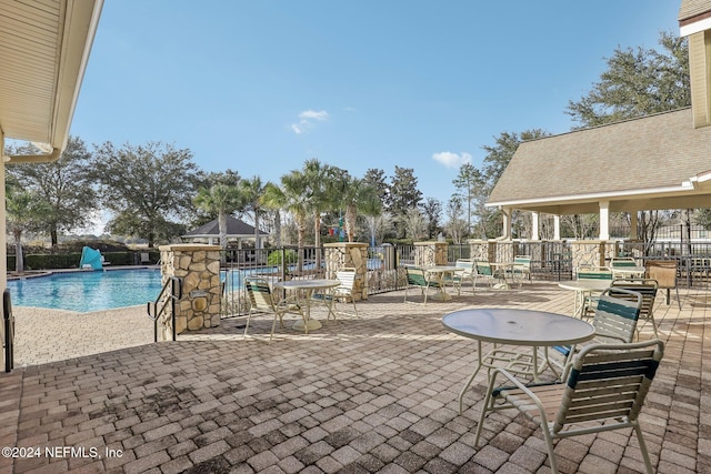 view of patio / terrace featuring a community pool