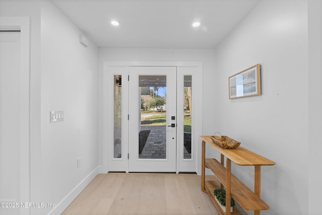 foyer entrance with light wood-type flooring