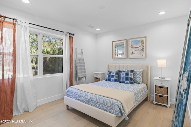 bedroom with light hardwood / wood-style flooring