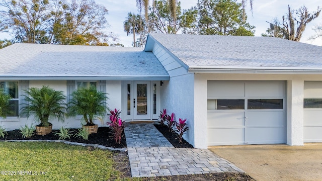 ranch-style home featuring a garage