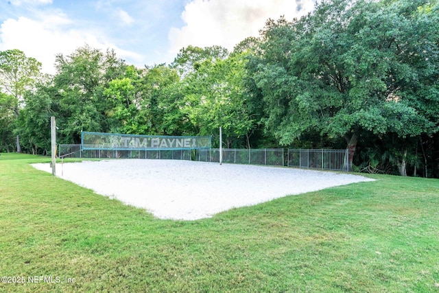 view of home's community with a lawn and volleyball court