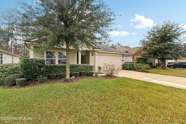 view of front of property with a garage and a front lawn