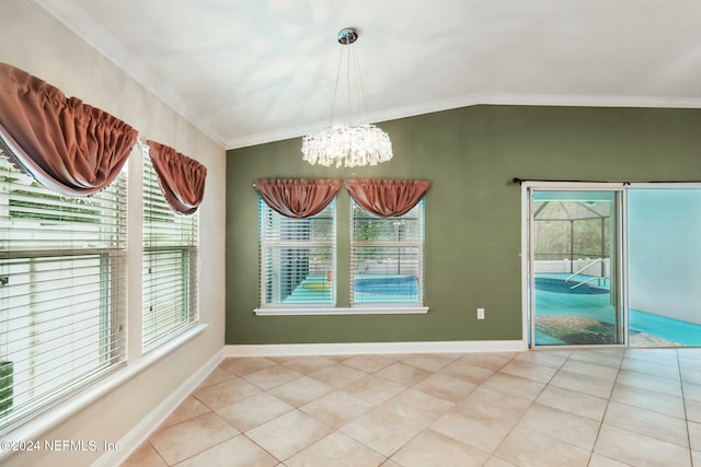 unfurnished dining area with a notable chandelier, plenty of natural light, crown molding, and vaulted ceiling