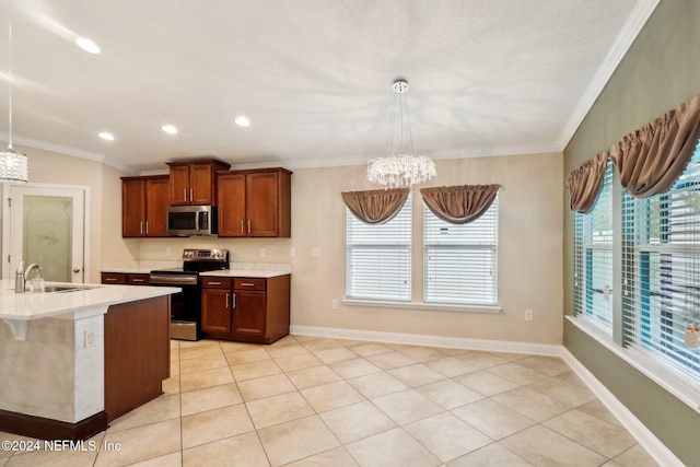 kitchen with pendant lighting, stainless steel appliances, ornamental molding, and sink