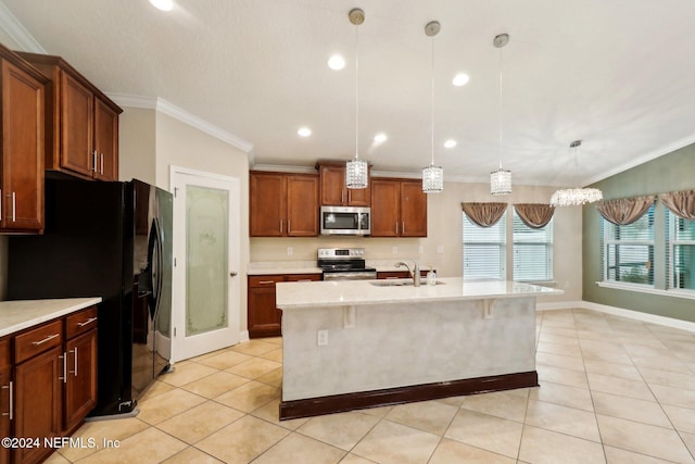 kitchen featuring appliances with stainless steel finishes, a kitchen island with sink, crown molding, sink, and pendant lighting