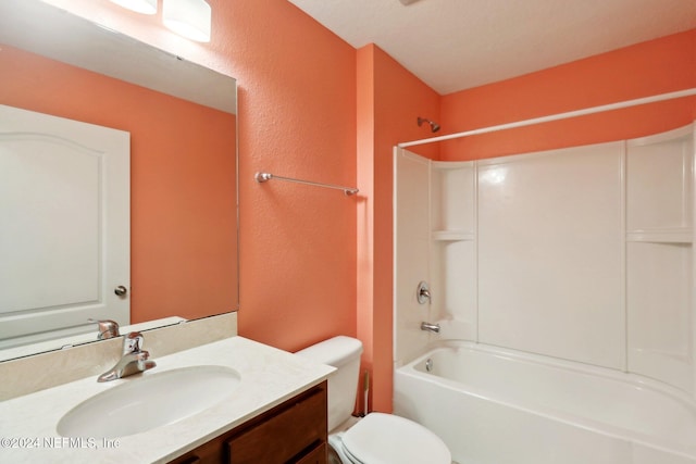 full bathroom featuring a textured ceiling, vanity, toilet, and  shower combination