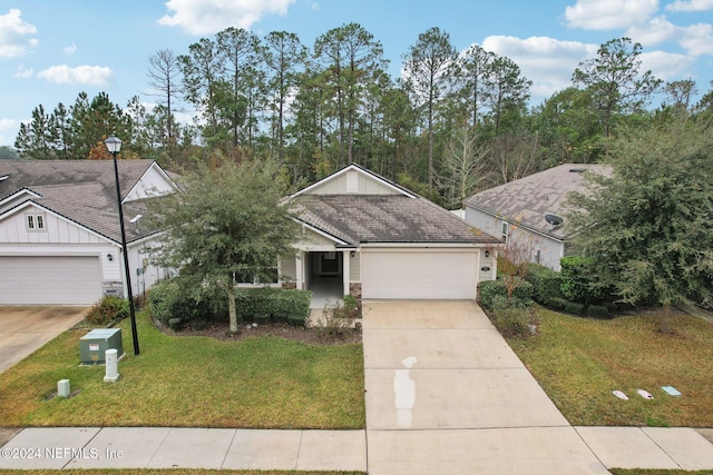 single story home with a garage and a front yard