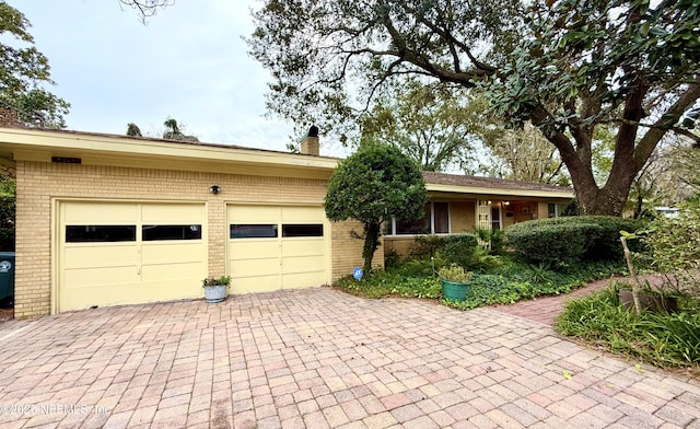 ranch-style house featuring a garage