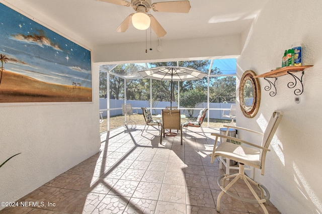 sunroom / solarium with ceiling fan