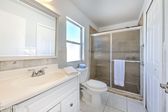 bathroom with tile patterned flooring, vanity, plenty of natural light, and walk in shower