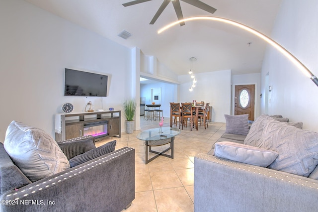 living room with high vaulted ceiling, ceiling fan, and light tile patterned flooring