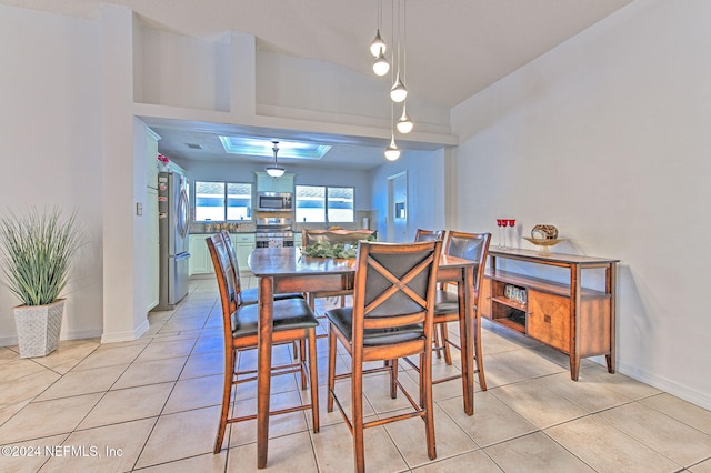 dining room with light tile patterned flooring