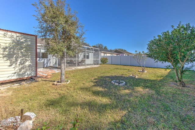 view of yard with a lanai