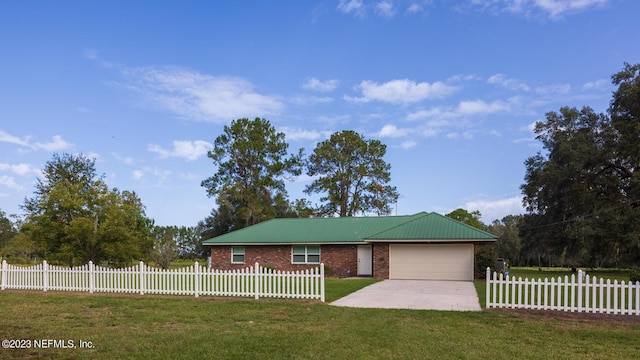 ranch-style house with a front yard and a garage