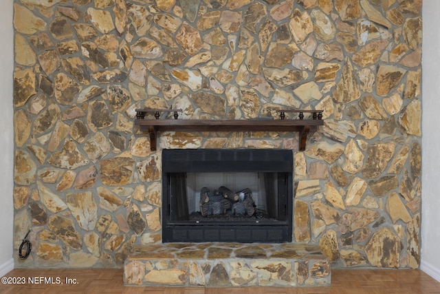 details with parquet flooring and a fireplace