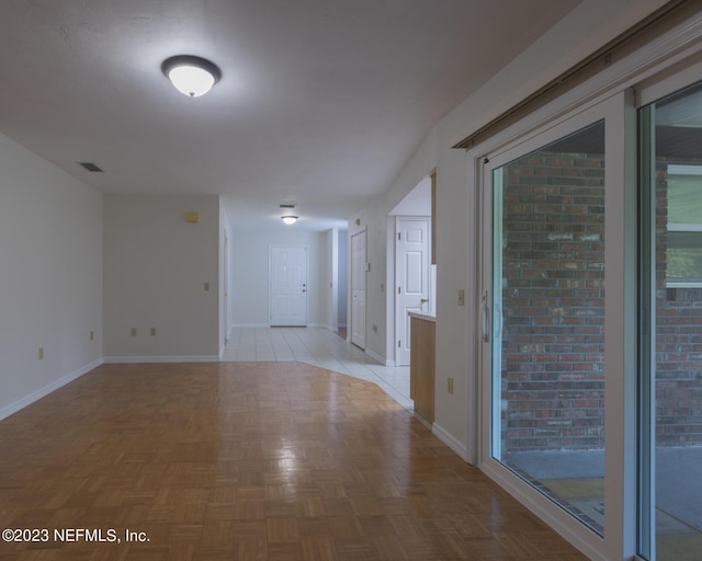 spare room featuring light parquet flooring