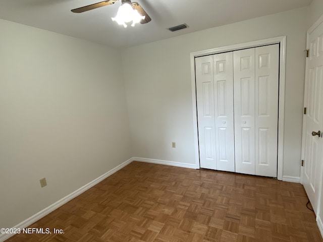 unfurnished bedroom with parquet flooring and ceiling fan