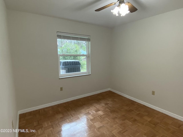 spare room with parquet flooring and ceiling fan