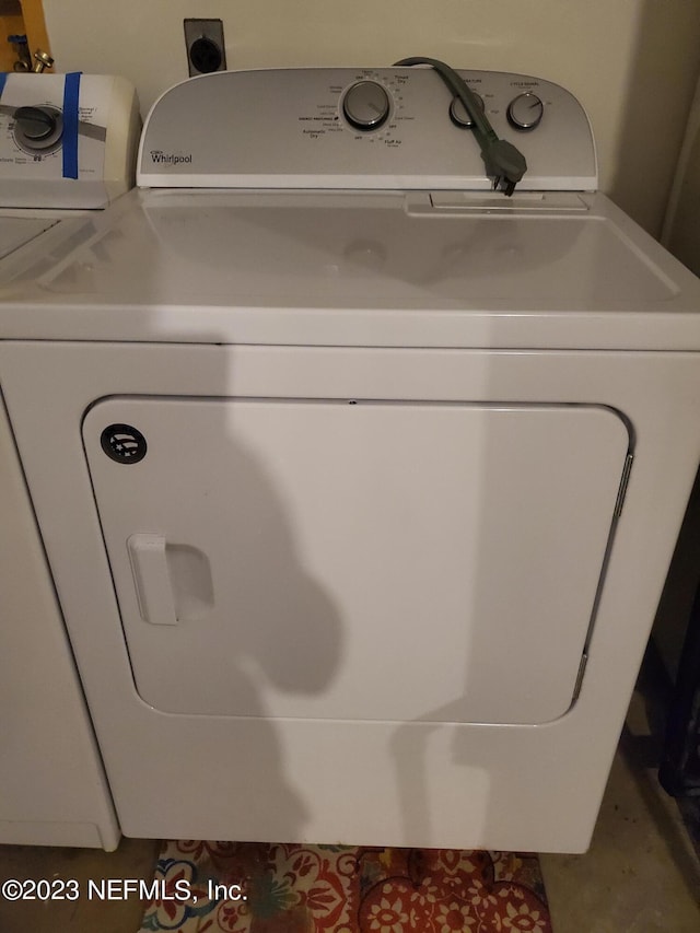 laundry room featuring separate washer and dryer