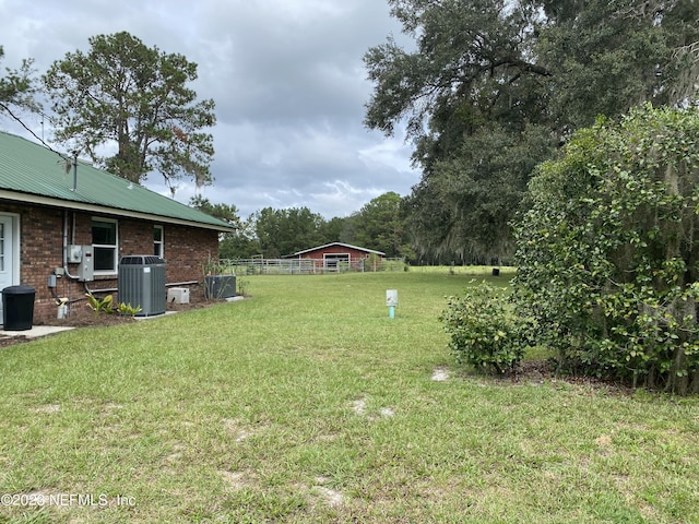 view of yard featuring central AC