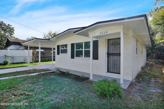 view of property exterior featuring a lawn