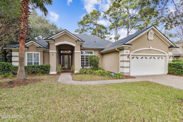 ranch-style house featuring a garage and a front yard