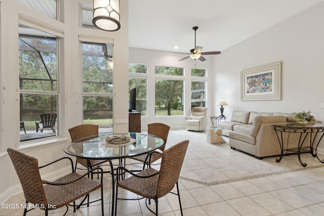 sunroom featuring ceiling fan