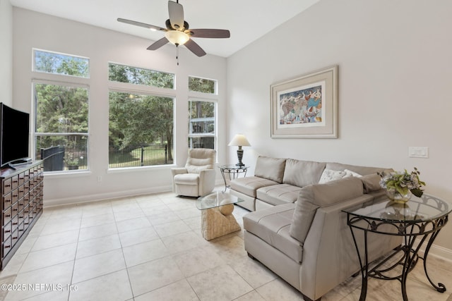 living room featuring ceiling fan and light tile patterned floors