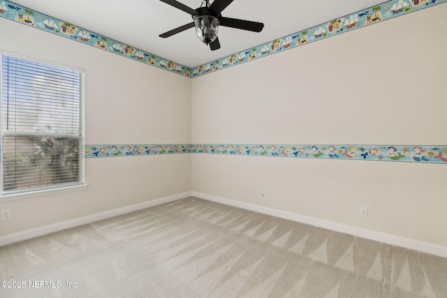 unfurnished room with ceiling fan and light carpet