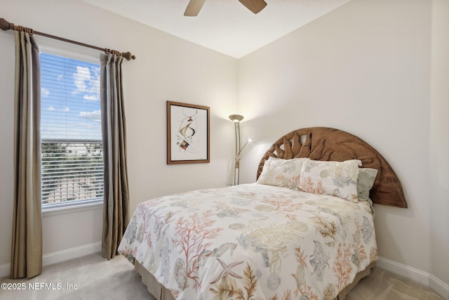 bedroom featuring ceiling fan and light carpet