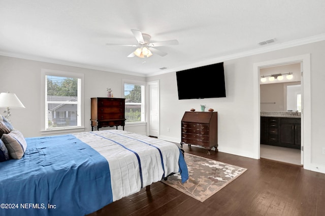 bedroom with connected bathroom, ceiling fan, crown molding, and dark hardwood / wood-style floors