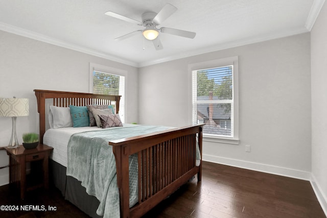 bedroom featuring ceiling fan, crown molding, dark wood-type flooring, and multiple windows