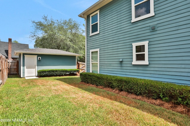 view of home's exterior with a yard