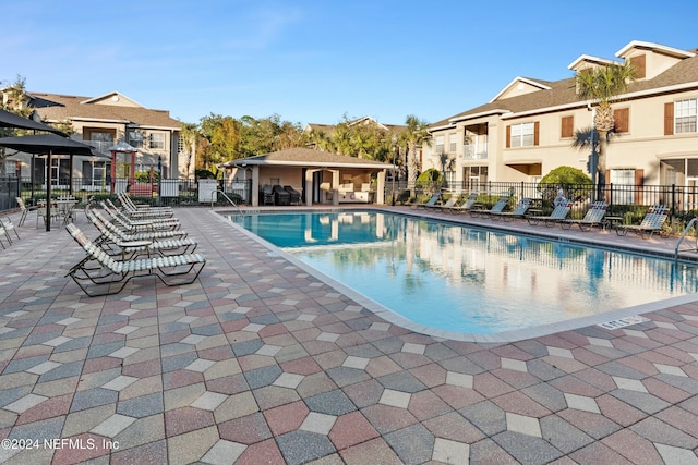 view of swimming pool with a patio area