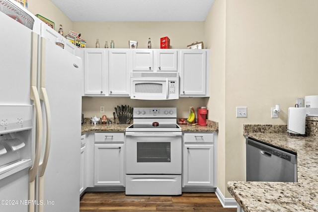 kitchen with white cabinetry, light stone counters, white appliances, and dark wood-type flooring