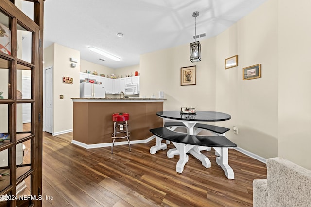 dining area featuring dark hardwood / wood-style flooring