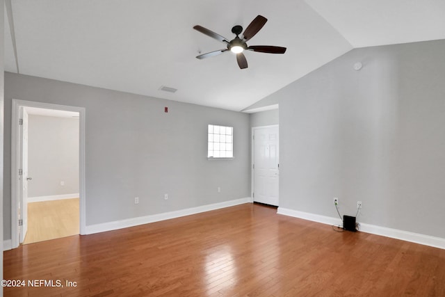 unfurnished room featuring hardwood / wood-style flooring, ceiling fan, and lofted ceiling