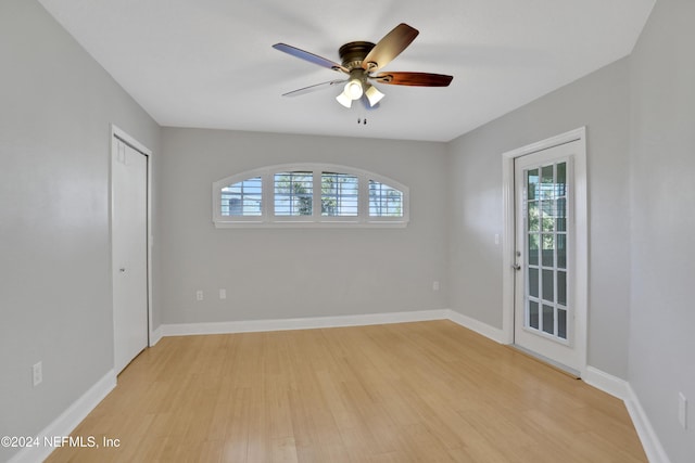 spare room featuring ceiling fan and light hardwood / wood-style flooring