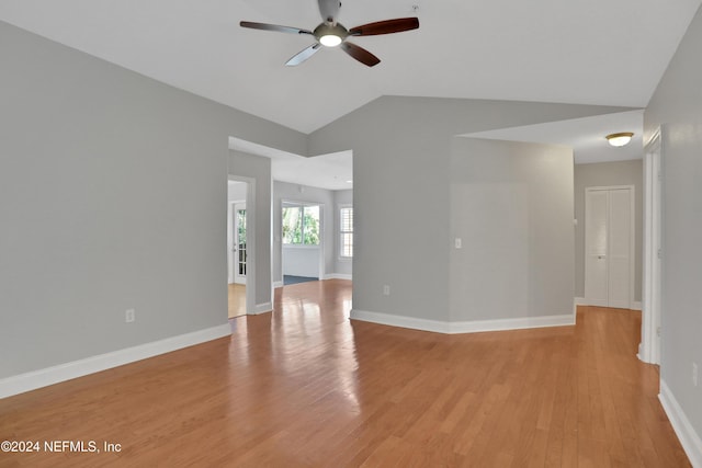 empty room with light hardwood / wood-style flooring, ceiling fan, and lofted ceiling