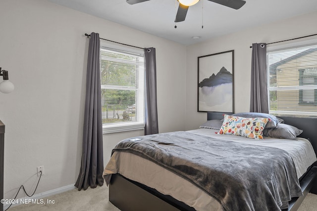 bedroom featuring light carpet and ceiling fan