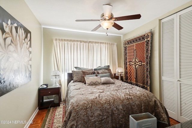 bedroom with ceiling fan and a closet