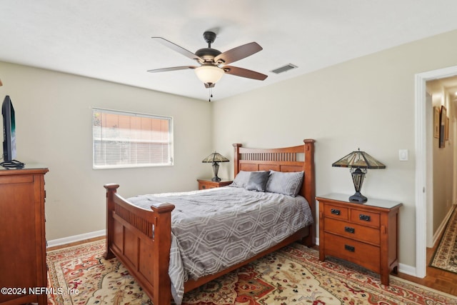 bedroom featuring light wood-type flooring and ceiling fan