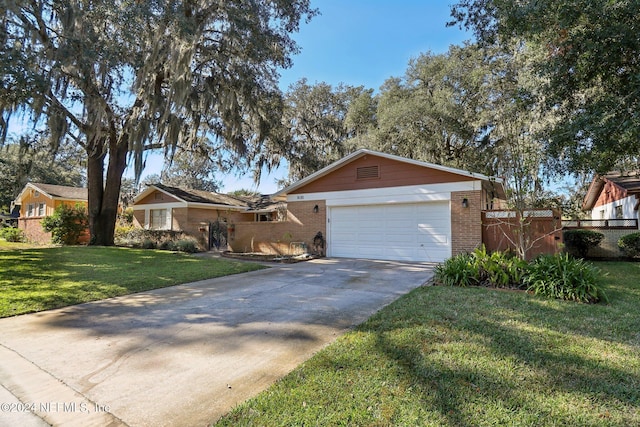 ranch-style house with a front yard and a garage