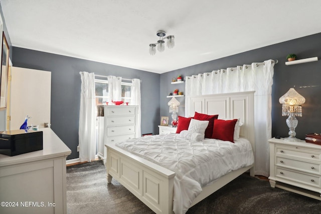 bedroom featuring dark carpet